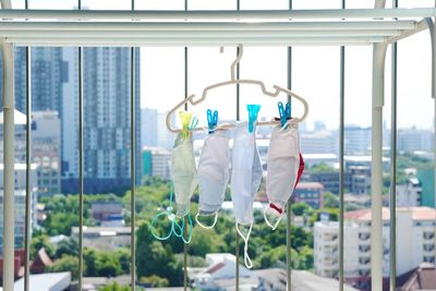 Close-up of clothes hanging on window