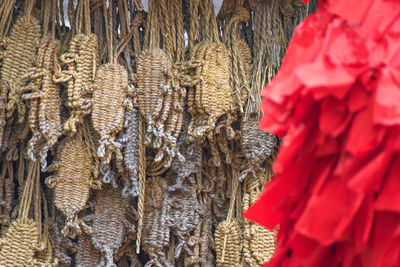 Close-up of red bell hanging at market stall