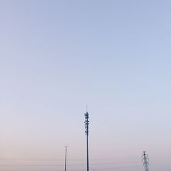 Electricity pylon against clear sky