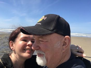Close-up of couple at beach