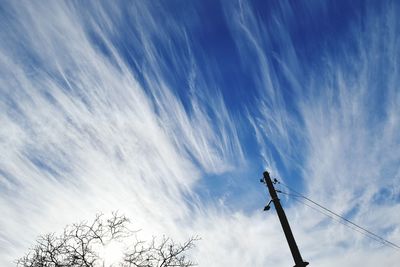 Low angle view of power lines against sky