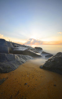 Scenic view of sea against sky during sunrise