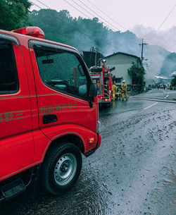 Red wet street in city during rainy season