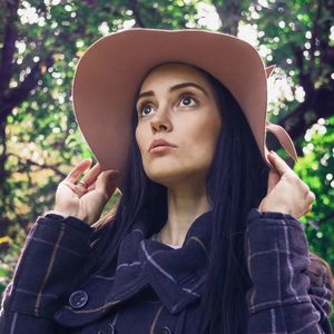 Portrait of beautiful young woman looking away