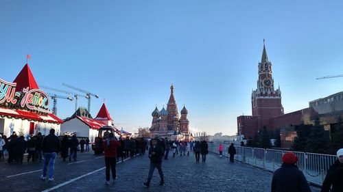 People at town square against clear sky