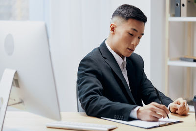 Businesswoman working at desk in office