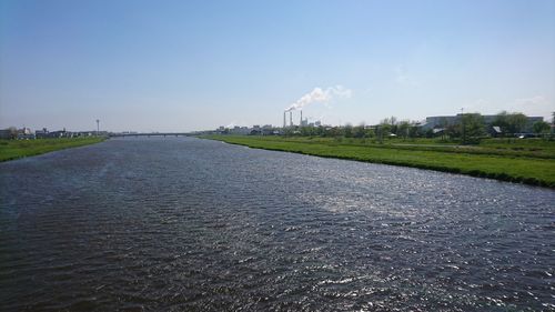 View of factory field against sky