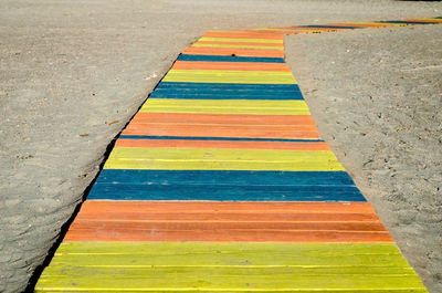 High angle view of multi colored wall by road
