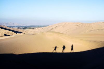 People walking in desert