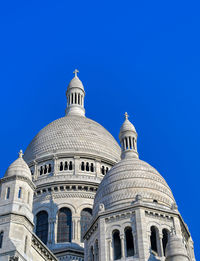 Low angle view of cathedral against blue sky