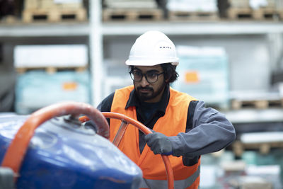 Young worker technician working in workshop