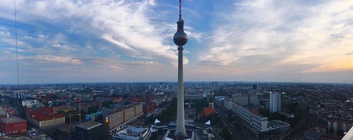 Silhouette of communications tower against sky