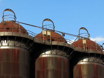 Low angle view of factory against sky