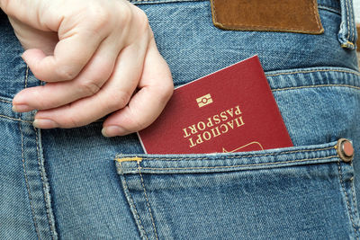 Close-up of woman holding passport