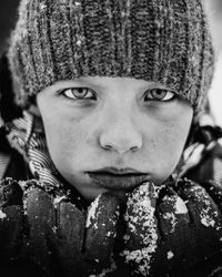 Close-up portrait of girl in snow