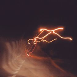 Close-up of fire over white background