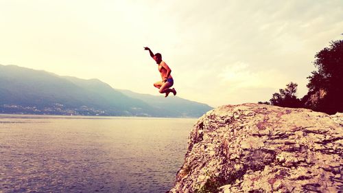 Woman jumping in sky