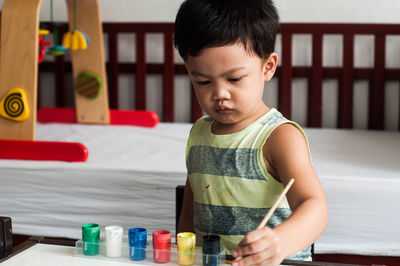 Boy painting at home