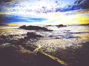 Scenic view of sea against sky at sunset