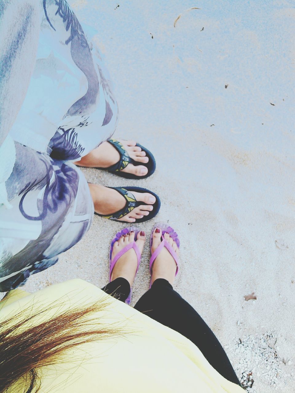 low section, person, lifestyles, high angle view, leisure activity, shoe, sand, personal perspective, beach, human foot, standing, footwear, barefoot, sunlight, shadow, day