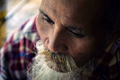 Close-up of man looking away outdoors