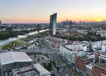 High angle view of city buildings during sunset