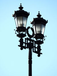 Low angle view of street light against sky