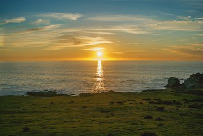 Scenic view of sea against sky during sunset