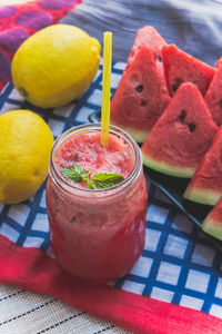 Close-up of watermelon smoothie in jar on table