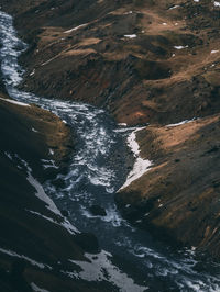 High angle view of waterfall amidst sea