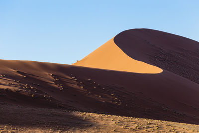 View of desert against clear sky