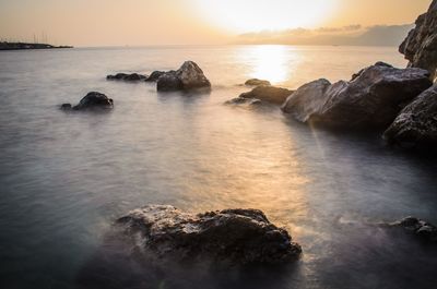 Scenic view of sea at sunset