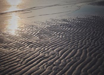 Scenic view of beach against sky during sunset