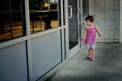 Full length of boy standing on floor