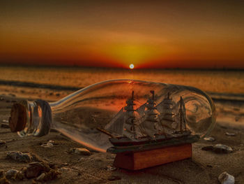 Ship in a bottle on a beach