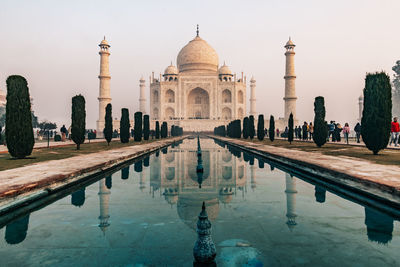 Taj mahal at foggy sunrise in winter