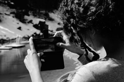Woman photographing with mobile phone