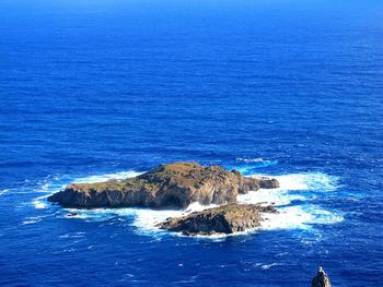 Scenic view of sea against blue sky