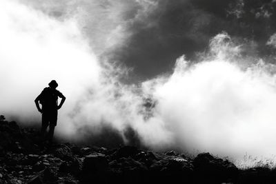 Silhouette of woman standing on landscape