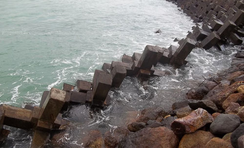 High angle view of groyne in sea