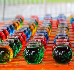Close-up of colorful liquid in glass containers on table