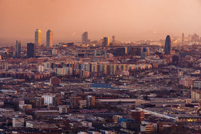 High angle view of city buildings during sunset