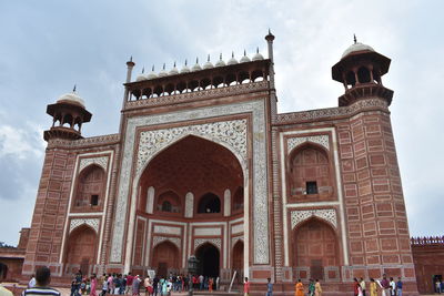 Group of people in front of historical building