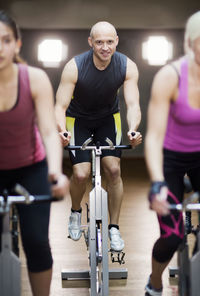 People training on exercising bikes