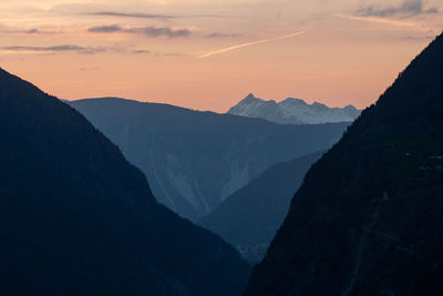 Scenic view of mountains against sky during sunset