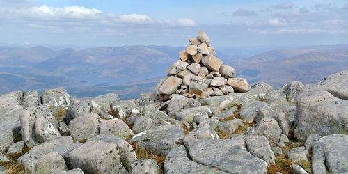 Scenic view of rocks and mountains against sky