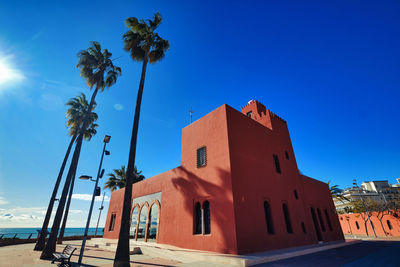 Low angle view of building against clear blue sky