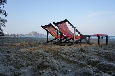Lifeguard hut on beach against sky