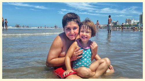 Portrait of happy girl in water