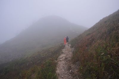 Scenic view of mountains in foggy weather